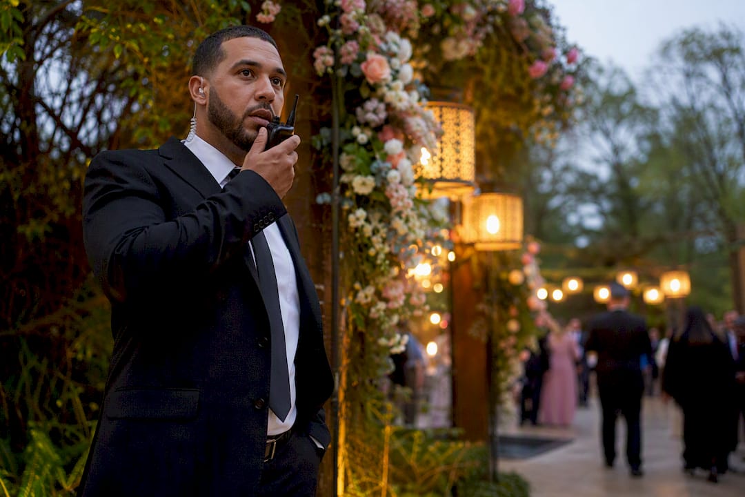 Wedding Security Planning in Boston: A Complete Guide Security guard communicating via radio at wedding event