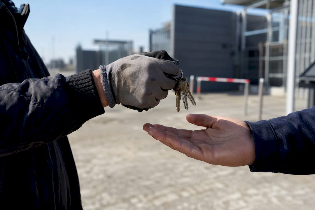 Hands exchanging security keys during mobilization